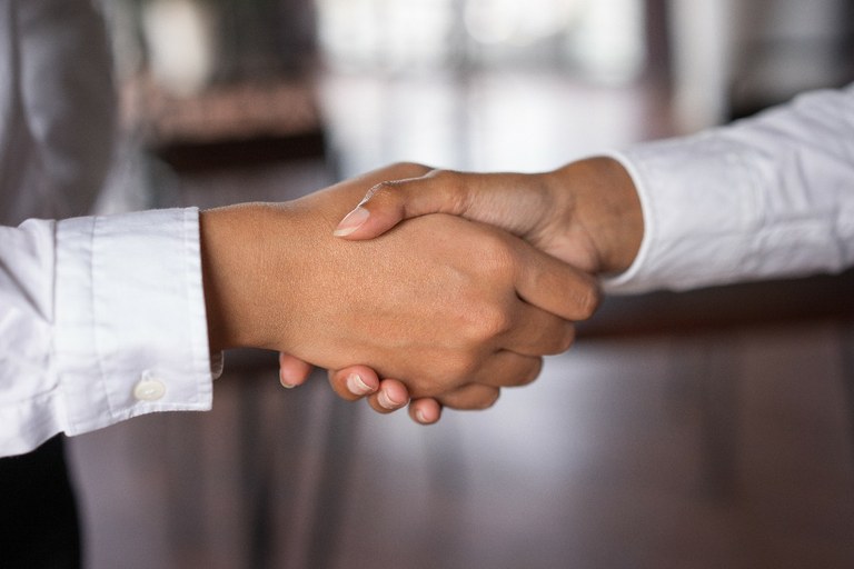 closeup-of-two-business-women-shaking-hands-business-agreement-concept.jpg